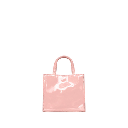 Shop Sarah Stewart Addie mini handbag in glossy light pink patent leather with a structured square silhouette.