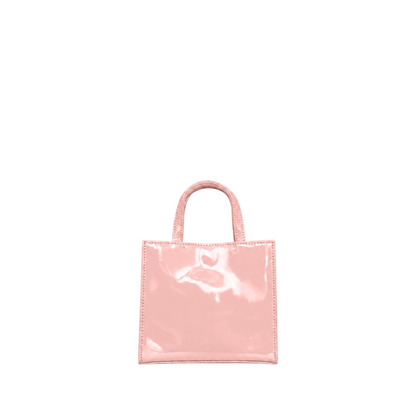 Shop Sarah Stewart Addie mini handbag in glossy light pink patent leather with a structured square silhouette.