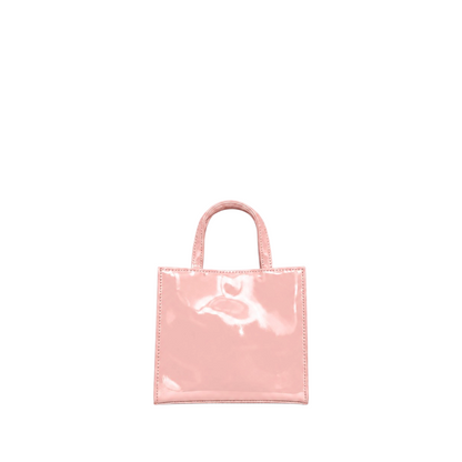 Shop Sarah Stewart Addie mini handbag in glossy light pink patent leather with a structured square silhouette.