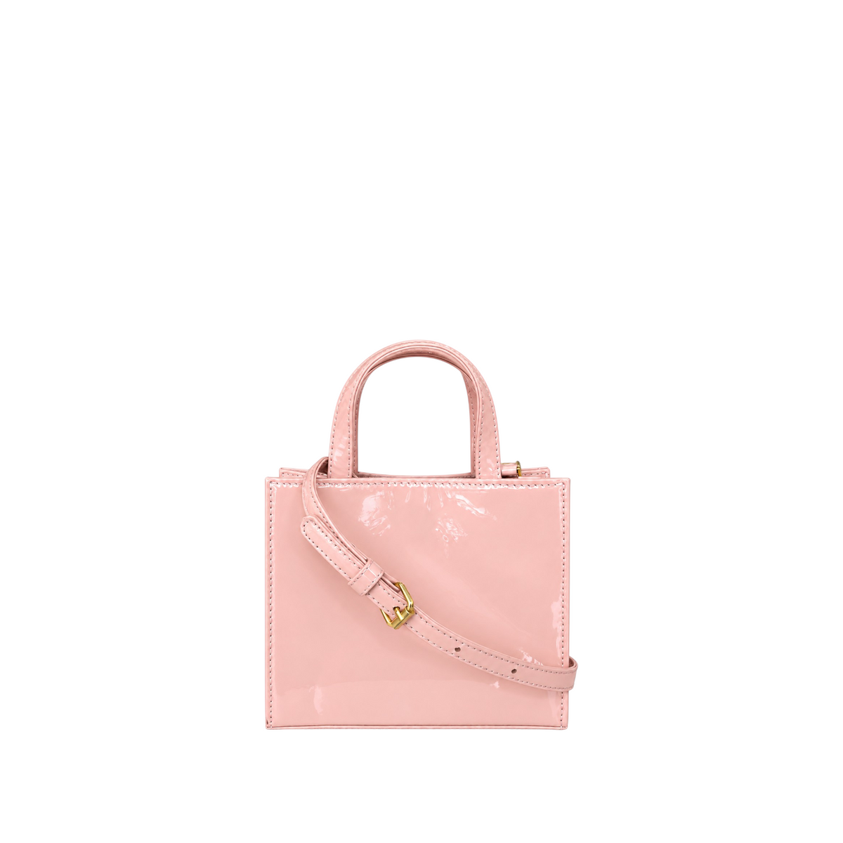 Shop Sarah Stewart Addie mini handbag in glossy light pink patent leather with gold hardware and shoulder strap