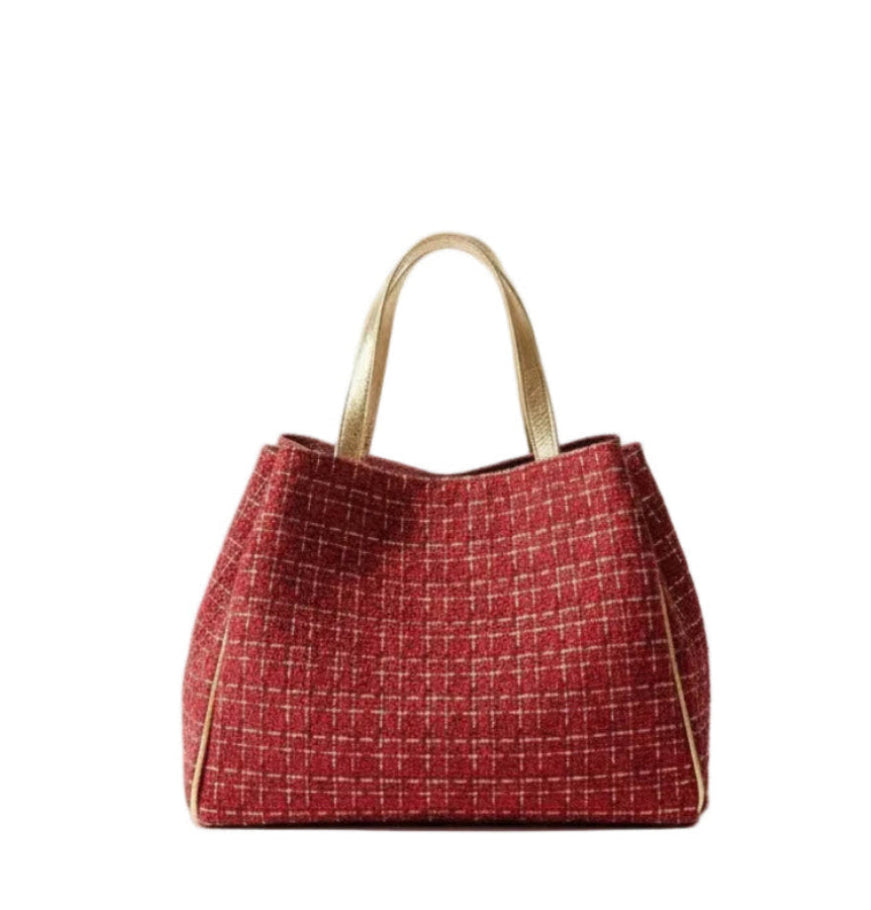 Red woven tweed tote bag with gold handles and gold detailing