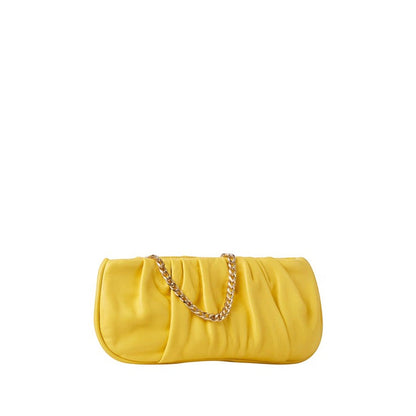 Shop Sarah Stewart Amina pleated yellow lambskin leather clutch with a gold-tone chain strap on a white background.