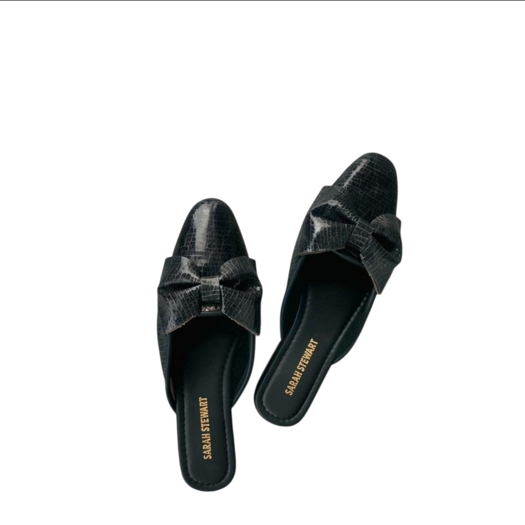 Shop Sarah Stewart Beverly Bow Mule in black lizard-embossed patent leather with a chic bow detail.