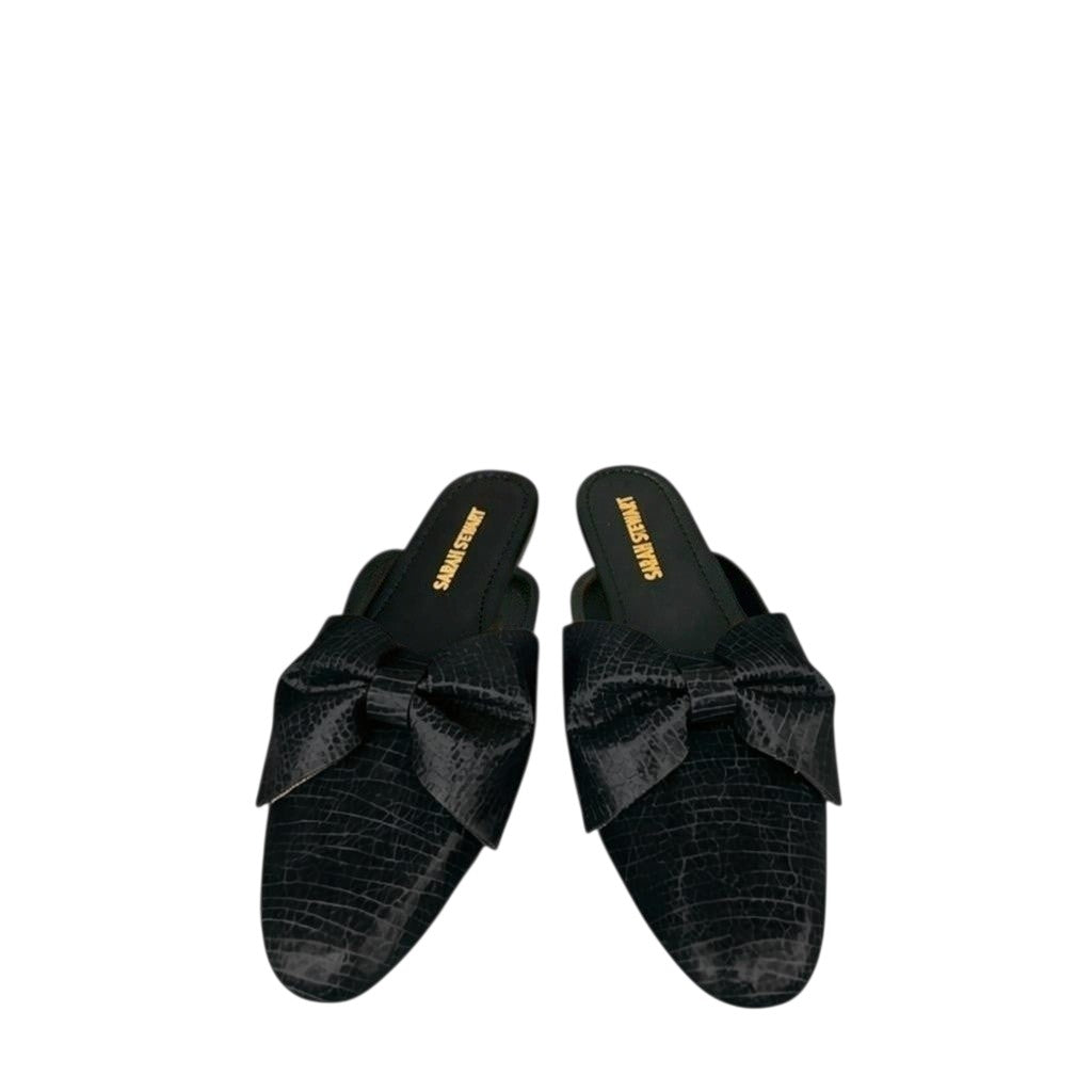 Shop Sarah Stewart black patent leather Beverly Bow Mules featuring a lizard embossed texture and a decorative bow.