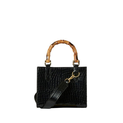 Shop Sarah Stewart Clara mini handbag in black goat skin with bamboo handles and gold hardware