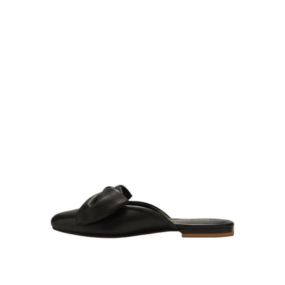 Shop Sarah Stewart black patent leather Beverly Bow Mule with lizard embossed texture and a decorative bow detail.