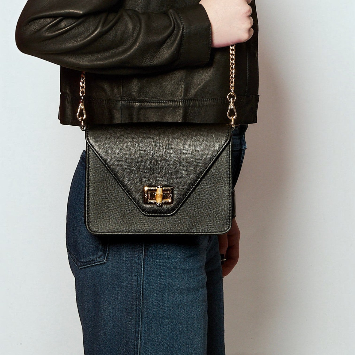 Shop Sarah Stewart The Stacey Stefano black saffiano leather crossbody bag with bamboo and metal hardware closure