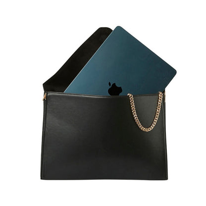 Shop Sarah Stewart black vegan leather laptop clutch with a gold chain strap and a laptop inside.