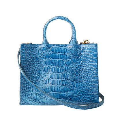 Shop Sarah Stewart Adelaide handbag in bright blue embossed goat skin leather with a detachable crossbody strap.