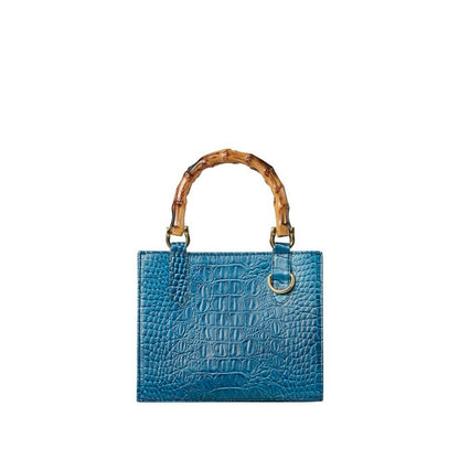 Shop Sarah Stewart Clara mini handbag in blue embossed goat skin with bamboo handles and gold hardware