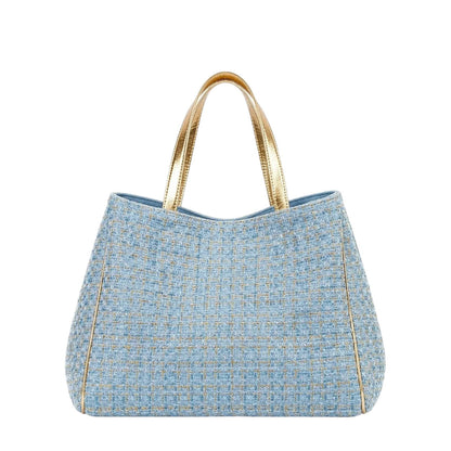 Shop Sarah Stewart Delilah Tweed tote bag in light blue with gold metallic handles and trim.