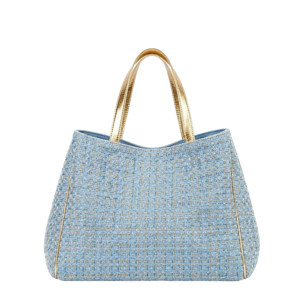Shop Sarah Stewart Delilah Tweed tote bag in light blue with gold metallic handles and trim.