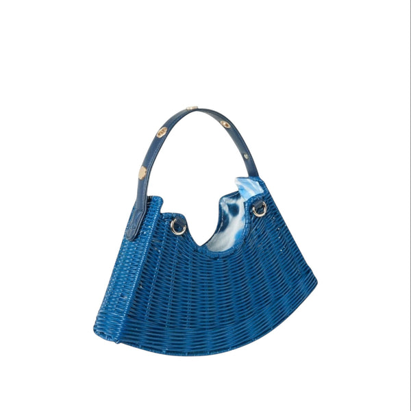 Shop Sarah Stewart blue handwoven wicker crescent bag with lambskin strap and gold floral accents.