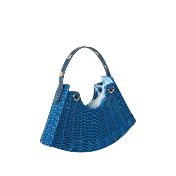 Shop Sarah Stewart Tati crescent bag in blue handwoven wicker with a leather strap and gold floral accents