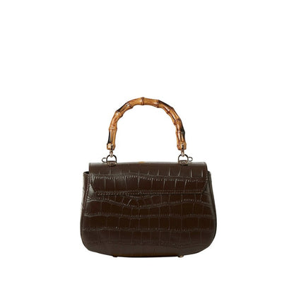 Shop Sarah Stewart The Chloe dark brown embossed goat skin suede handbag with a bamboo handle and gold closure.