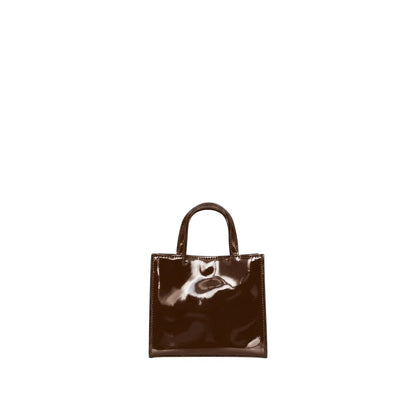 Shop Sarah Stewart Addie mini handbag in glossy dark brown patent leather with a structured square silhouette.