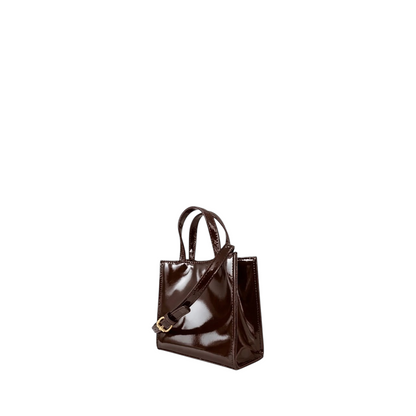 Shop Sarah Stewart Addie mini handbag in glossy dark brown patent leather with structured silhouette and top handles