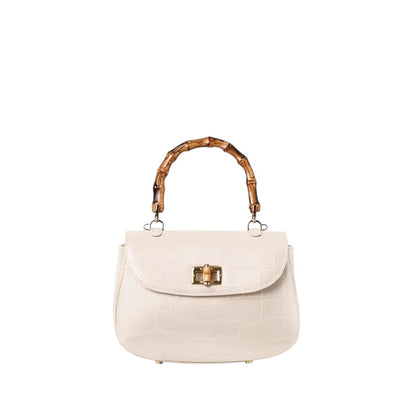 Shop Sarah Stewart Chloe handbag in cream embossed goat skin suede with a bamboo handle and gold bamboo closure