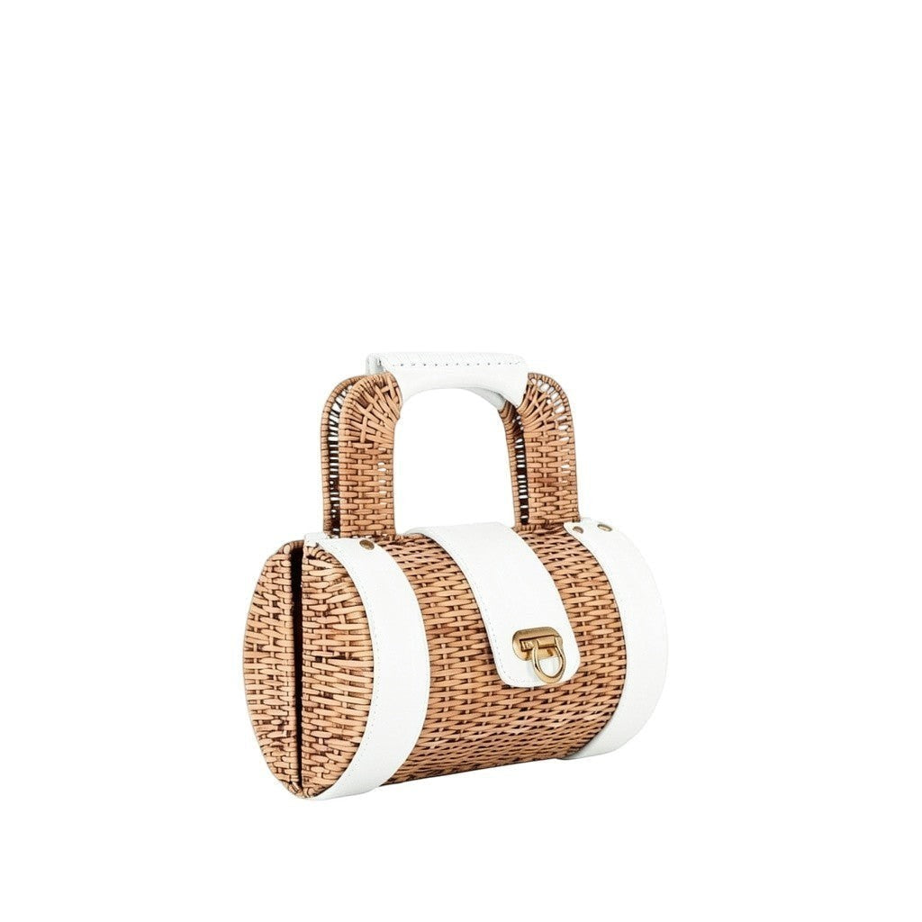 Shop Sarah Stewart The Jordan Handbag, a cylindrical wicker bag with red lambskin accents and gold hardware.