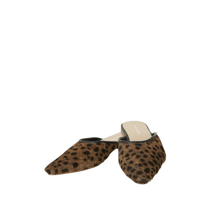 Shop Sarah Stewart Mabrey pointed-toe mules in leopard print calf hair leather with black trim.