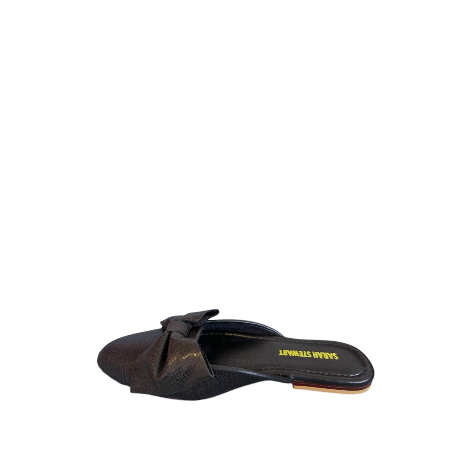 Shop Sarah Stewart Beverly Bow Mule in dark brown lizard-embossed patent leather with a decorative bow detail.