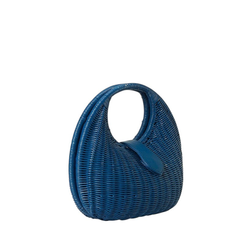 Shop Sarah Stewart Matilda blue wicker handbag with leather strap detail. A modern, relaxed luxury accessory.