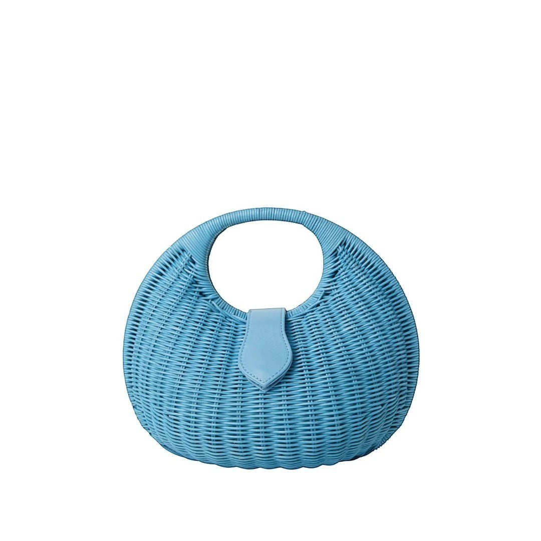 Shop Sarah Stewart Matilda blue wicker handbag with leather closure and cutout handle. Summer accessory.