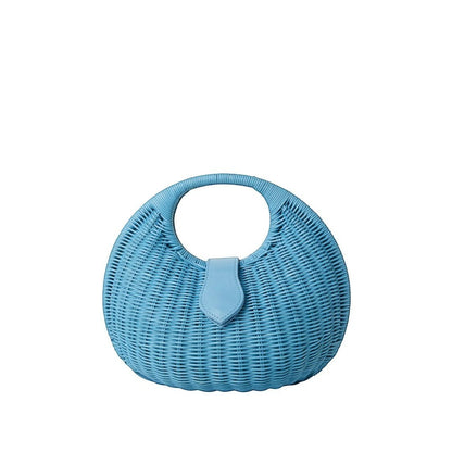 Shop Sarah Stewart Matilda blue wicker handbag with leather closure and cutout handle. Summer accessory.