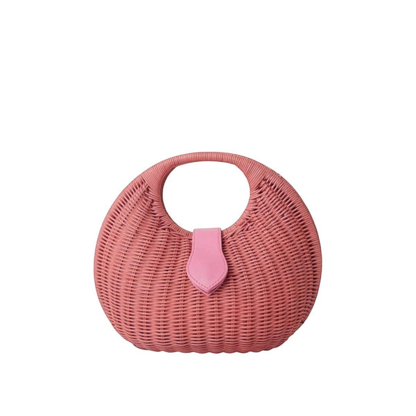 Shop Sarah Stewart Matilda pink wicker handbag with leather strap detail and cotton lining. A summer accessory.