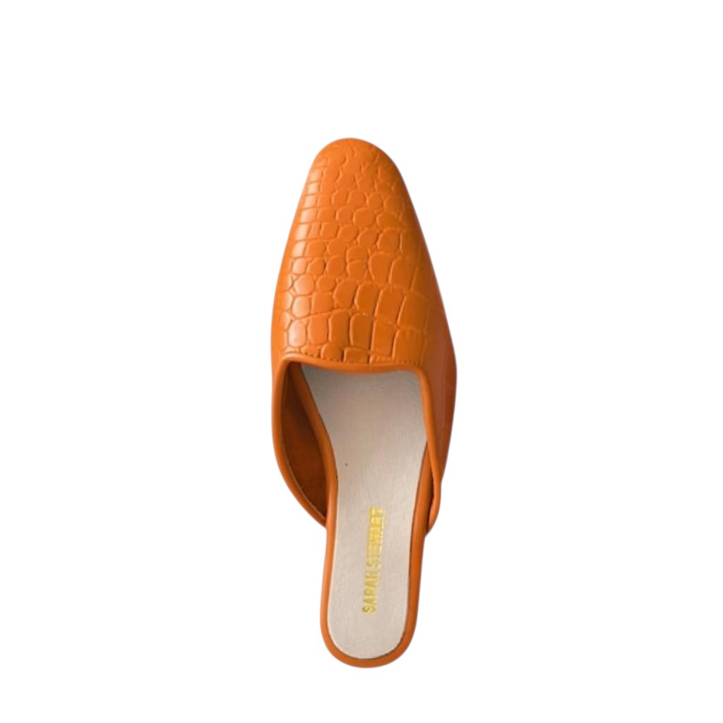 Shop Sarah Stewart Clara mule in orange embossed goat skin leather with a chic vintage-inspired square toe design.