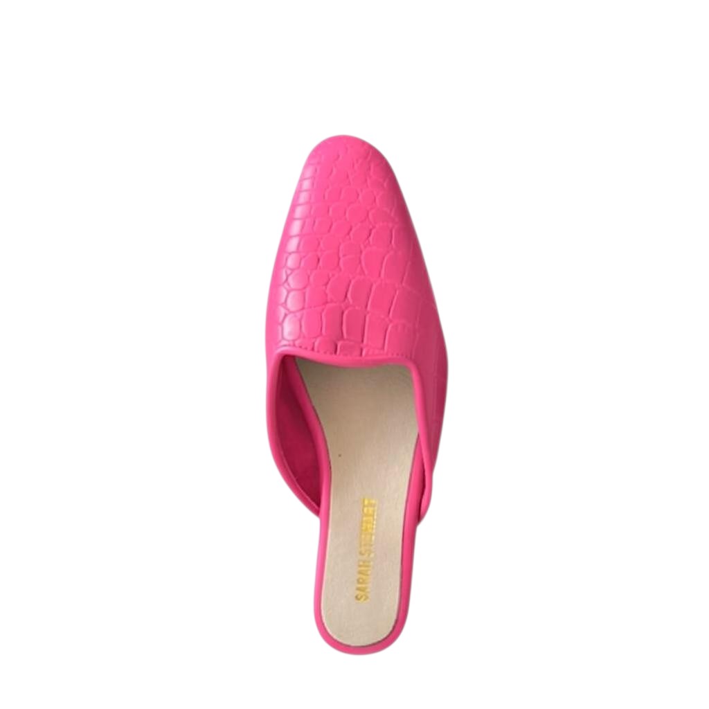 Shop Sarah Stewart Clara mule in hot pink embossed goat skin leather with a vintage-inspired square toe design.