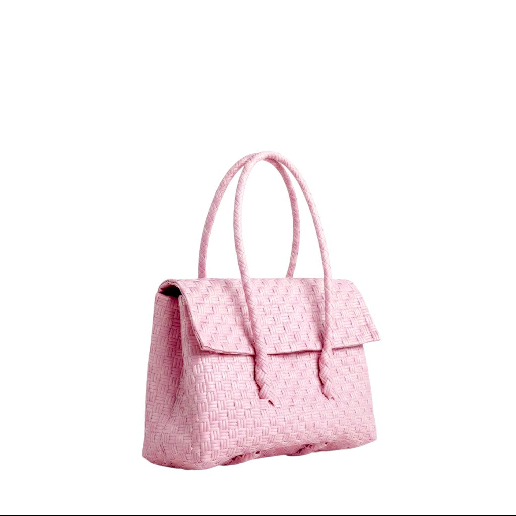 Shop Sarah Stewart light pink handwoven recycled plastic mini Kelly handbag with a snap fold top closure.