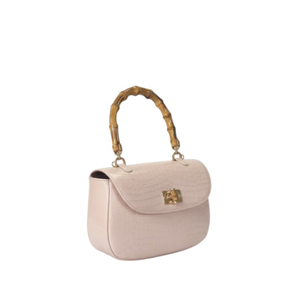 Shop Sarah Stewart Chloe handbag in blush pink embossed goat skin suede with a bamboo handle and gold hardware.