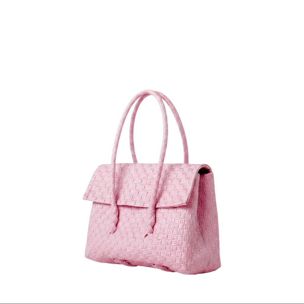 Shop Sarah Stewart light pink handwoven recycled plastic mini Kelly handbag with a snap fold top closure.