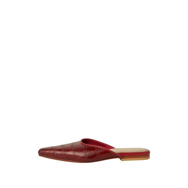 Shop Sarah Stewart Mabrey pointed-toe mule in deep red crocodile-printed leather with a flat heel.