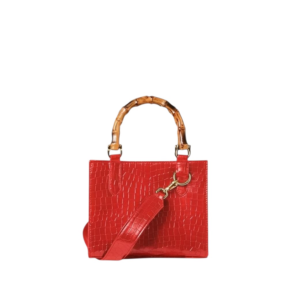 Shop Sarah Stewart red goat skin Clara mini handbag with bamboo handles, gold hardware, and detachable crossbody strap.