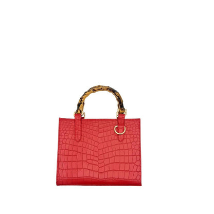 Shop Sarah Stewart Clara mini handbag in red embossed goat skin leather with unique bamboo handles and gold hardware.
