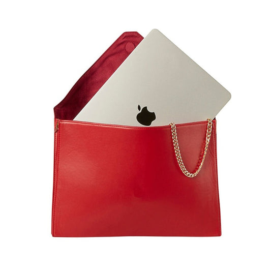 Shop Sarah Stewart red vegan leather laptop clutch with gold chain strap and magnetic closure holding a laptop
