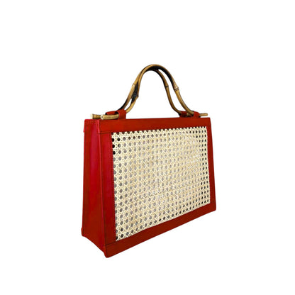 Shop Sarah Stewart The Reece structured red lambskin leather handbag with natural wicker panels and bamboo handles.