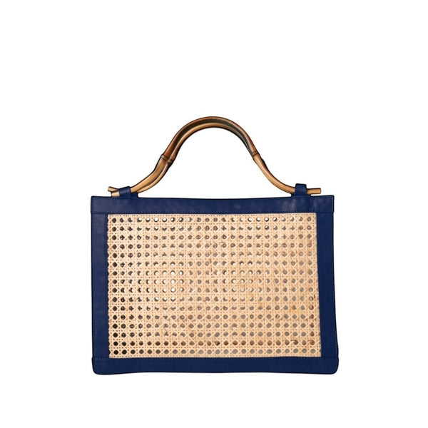 Shop Sarah Stewart The Reece structured handbag in natural wicker with navy lambskin leather and bamboo handle.