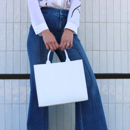 Shop Sarah Stewart white croc-embossed leather Adele handbag with structured rectangular design held by a model