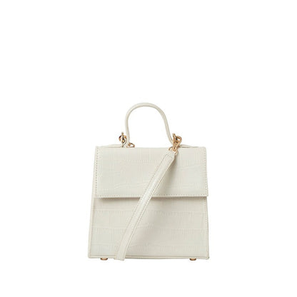Shop Sarah Stewart white goat skin leather handbag with crocodile pattern and gold hardware details.