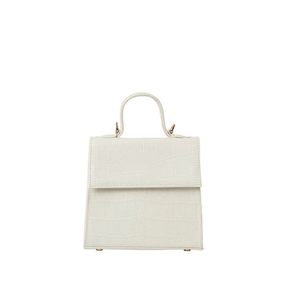 Shop Sarah Stewart white goat skin leather handbag with crocodile pattern and gold hardware details.