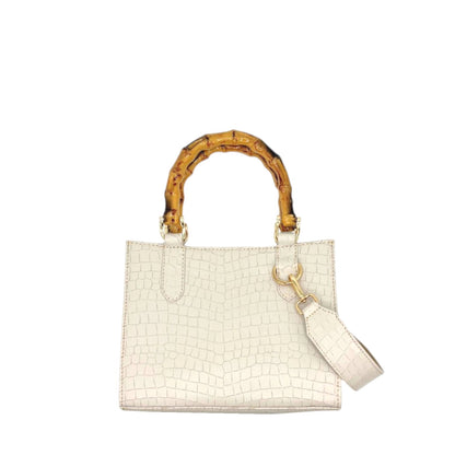 Shop Sarah Stewart Clara mini handbag in white embossed goat skin with bamboo handles and gold hardware.